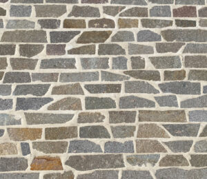 Italian Filetti natural stone paving in mixed grey tones with irregular shapes and textured surface